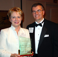 Dr. Alice Jacobs accepts ICCTA's inaugural Advocacy Award from ICCTA president Tom Bennett.