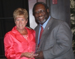 Dr. Gayle Saunders accepts ICCTA's 2012 Advocacy Award from ICCTA vice president Reggie Coleman.