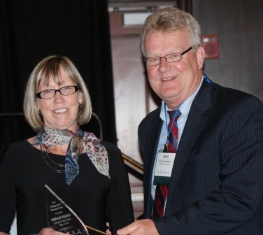 Deborah Nelson accepts ICCTA's 2012 Distinguished Alumnus Award from former ICCTA president Rich Anderson.