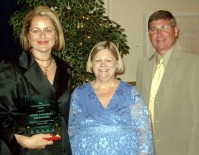 Penny Deligiannis (left) accepts ICCTA's 2008 Distinguished<br>Alumnus Award from ICCTA president Kathy Wessel and Illinois Community College Board chair Guy Alongi.