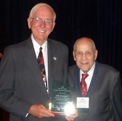 Kaskaskia College trustee Jim Beasley (left) receives ICCTA's 2008 Ray Hartstein Trustee Achievement Award from ICCTA Honorary Member Ray Hartstein.