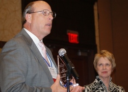 Michael L. Brown, president/CEO of Provena United Samaritans Medical Center, accepts ICCTA's 2011 Business/Industry Partnership Award as Danville Area Community College president Dr. Alice Marie Jacobs looks on.