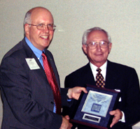 ICCTA executive director Gary Davis (left) presents John Duffy with his 2002 Ray Hartstein Trustee Achievement Award.
