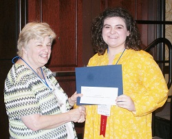Southeastern Illinois College student Callie Smith (right) accepts her $500 Paul Simon Student Essay Contest scholarshipfrom ICCTA secretary Kathy Spears.
