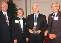 Bruce L. Conners (third from left) accepts ICCTA's 2006 Gary W. Davis Ethical Leadership Award from Kaskaskia College trustee Jim Beasley, ICCTA president Tom Bennett, and KC president James Underwood.