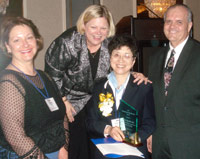 Jane Wu of the College of DuPage (center) accepts ICCTA's 2007 Outstanding Faculty Member Award from COD trustee Mary Mack, ICCTA president (and COD trustee) Kathy Wessel, and COD board chair Micheal McKinnon.
