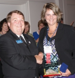 Dr. Wendy Brown of Danville Area Community College accepts ICCTA's 2010 Outstanding Full-Time Faculty Member Award from ICCTA vice president David Harby.
