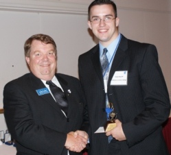 Cody Sheriff (right) accepts ICCTA's 2010 Gigi Campbell Student Trustee Excellence Award from ICCTA vice president David Harby.