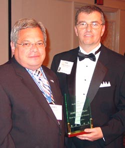 James Kaplan (left) accepts his Meritorious Service Award from ICCTA president Tom Bennett.