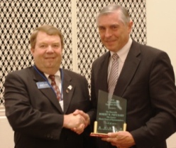 State Rep. Robert Pritchard (right) accepts ICCTA's 2010 Outstanding Legislator Award from ICCTA vice president David Harby.