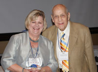 Kathy Wessel receives ICCTA's 2011 Ray Hartstein Trustee Achievement Award from award namesake Ray Hartstein.
